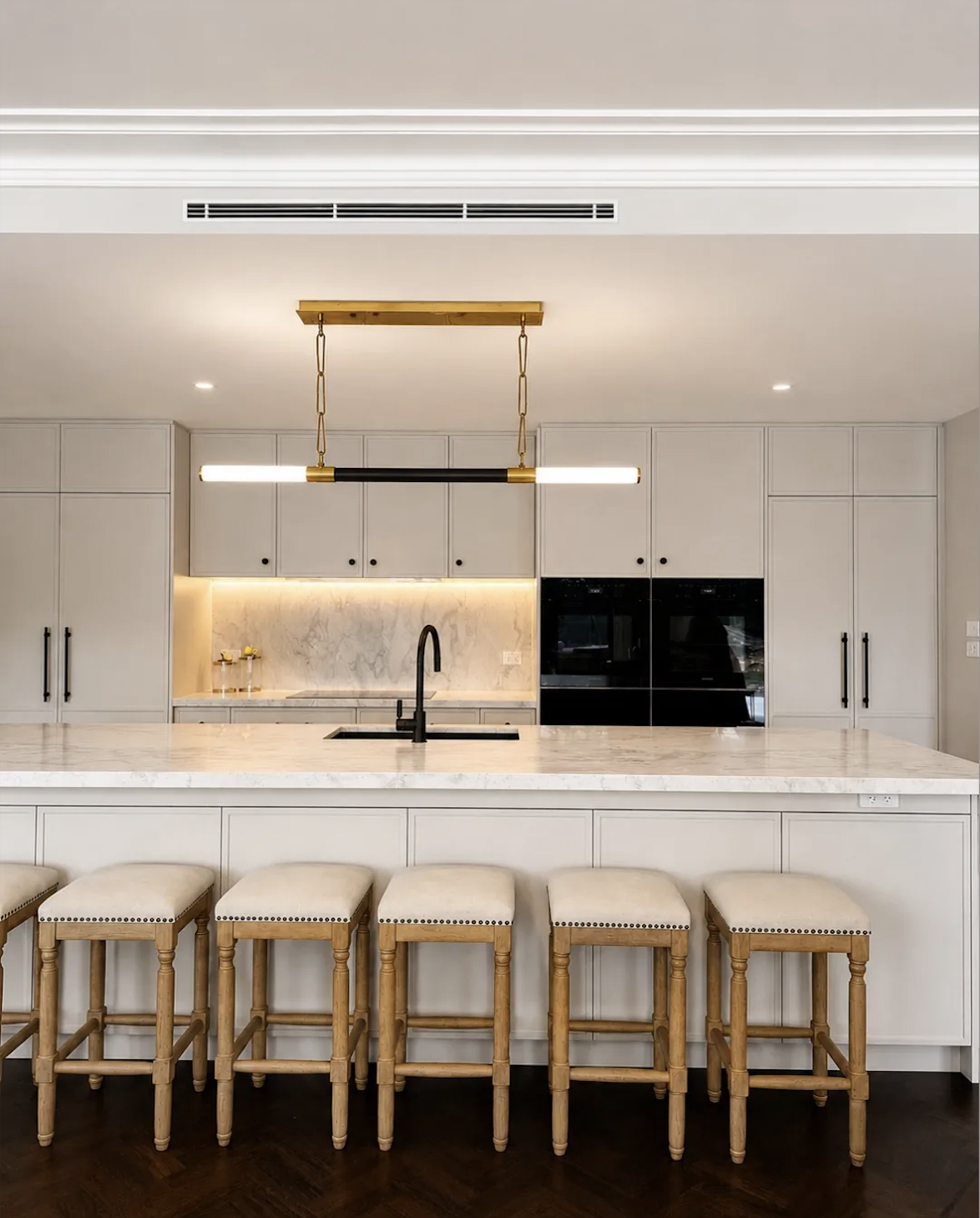 Luxury custom shaker kitchen by Morlin Kitchens featuring a large marble island, integrated appliances, bespoke cabinetry and warm neutral finishes in Sydney